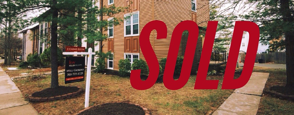 House in Herndon VA with Realtor Sign Out Front and the word "SOLD" placed over top the entire image