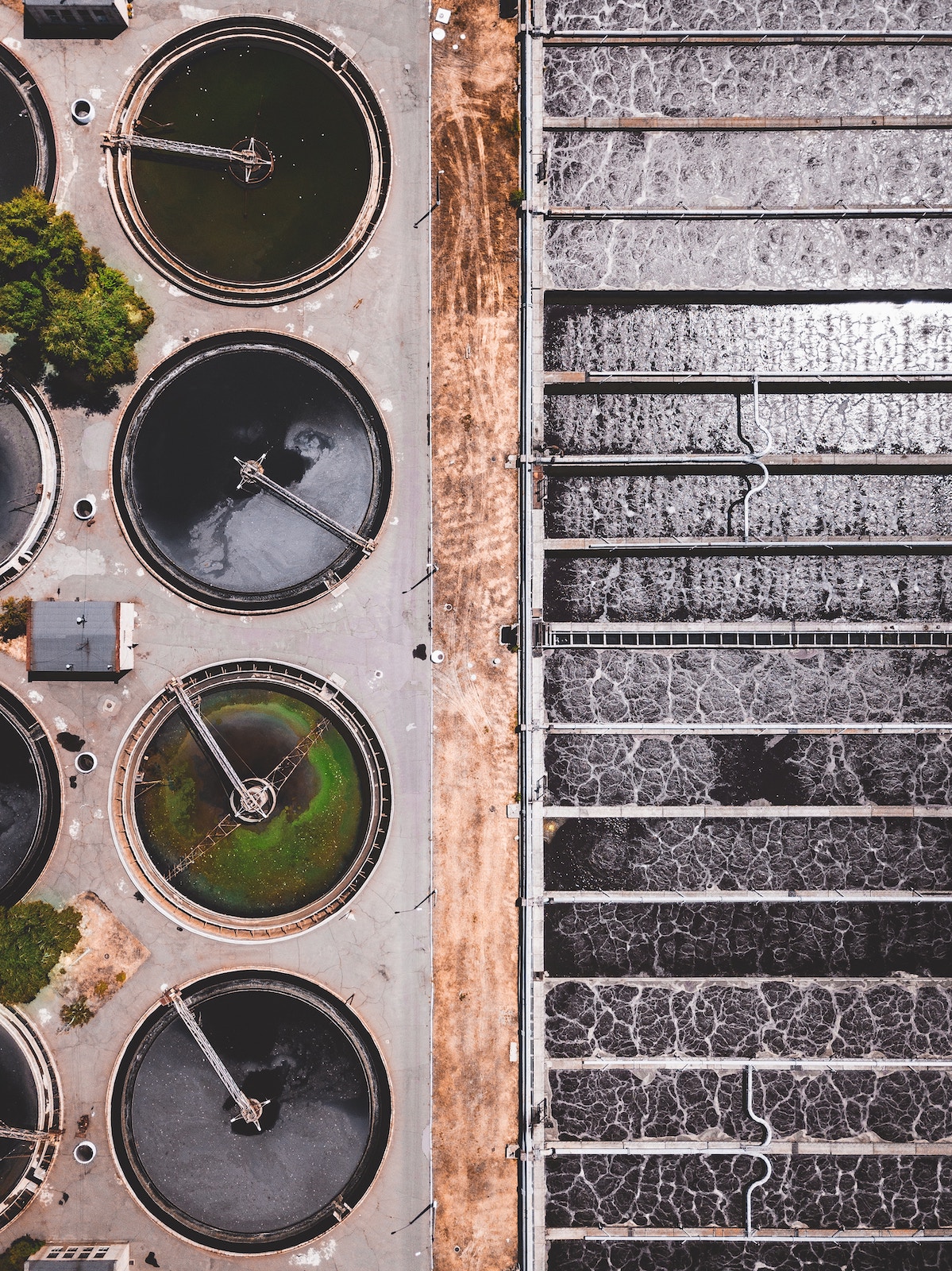 Overhead photo of water treatment facility including in-ground tanks and filtration